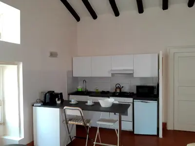 Cucina o angolo cottura di Incantevole appartamento in palazzo storico Ortigia