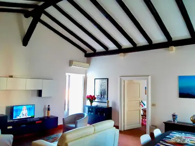 TV o dispositivi per l'intrattenimento presso Incantevole appartamento in palazzo storico Ortigia