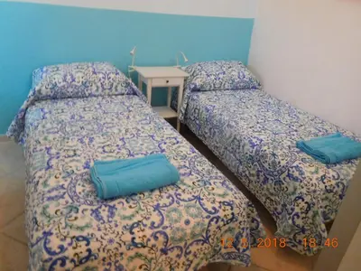 Letto o letti in una camera di Casa Anita