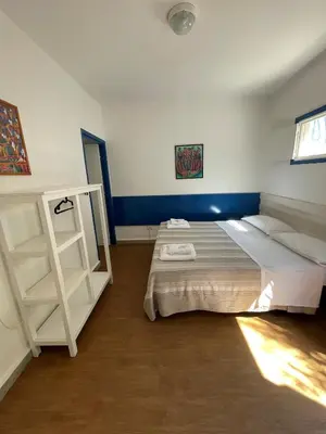 Letto o letti in una camera di Villaggio Turistico Europeo