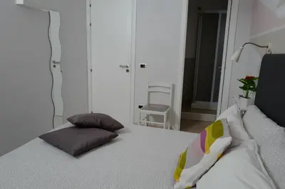 Letto o letti in una camera di Apartments TERRAZZA DEI DUE MARI
