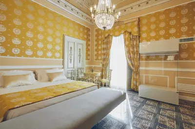 Letto o letti in una camera di Palazzo Marletta Luxury House Hotel
