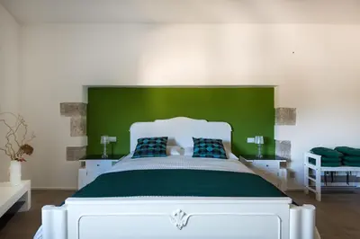 Letto o letti in una camera di La Latomia Villa nei pressi del Teatro Greco