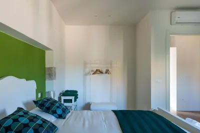 Letto o letti in una camera di La Latomia Villa nei pressi del Teatro Greco