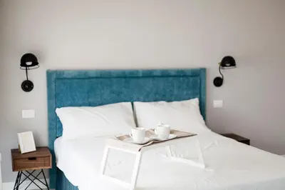 Letto o letti in una camera di Le Bain Suite - accanto al Mare vicinissima a Ortigia e al Teatro