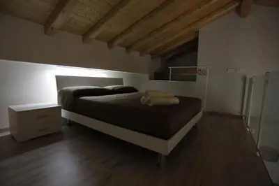 Letto o letti in una camera di I Loft di Nonna Vincenza