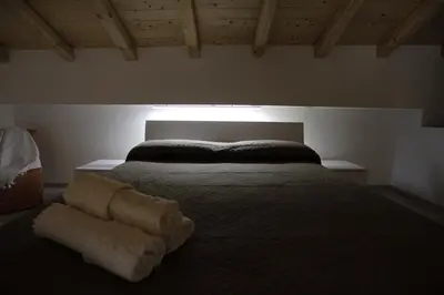 Letto o letti in una camera di I Loft di Nonna Vincenza