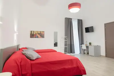 Letto o letti in una camera di Fladi House Catania