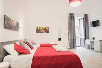 Letto o letti in una camera di Fladi House Catania