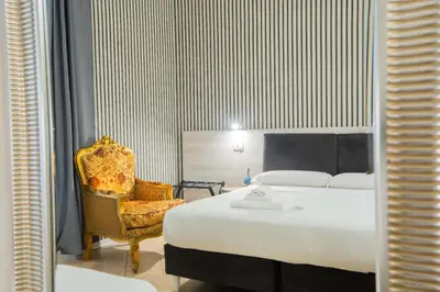 Letto o letti in una camera di Hotel Trieste