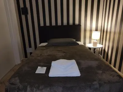 Letto o letti in una camera di Hotel Trieste