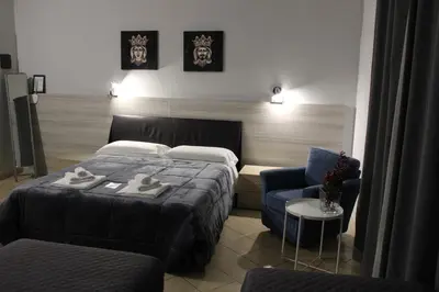 Letto o letti in una camera di Hotel Trieste