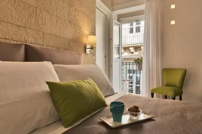 Letto o letti in una camera di Sciala Ortigia B&B