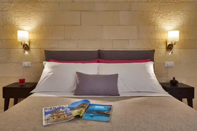 Letto o letti in una camera di Sciala Ortigia B&B