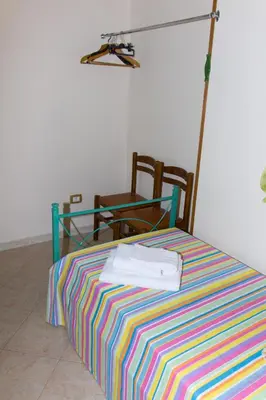 Letto o letti in una camera di Casa Caramella