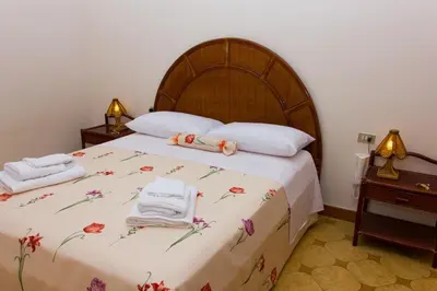 Letto o letti in una camera di Casa Caramella
