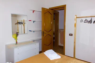 Letto o letti in una camera di Casa Caramella