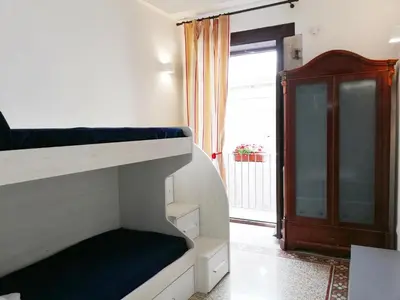 Letto o letti in una camera di CIVICO 5 ORTIGIA - TERRAZZA VISTA MARE