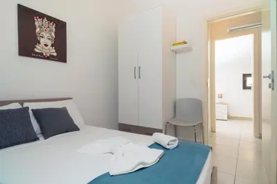 Letto o letti in una camera di mungiBEDdu Apartment