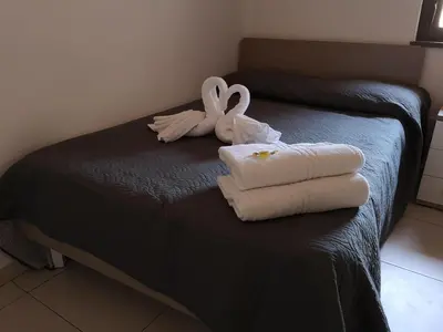 Letto o letti in una camera di mungiBEDdu Apartment