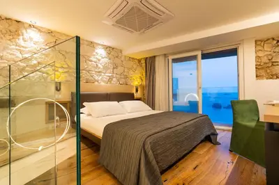 Letto o letti in una camera di Re Dionisio Luxury Suites