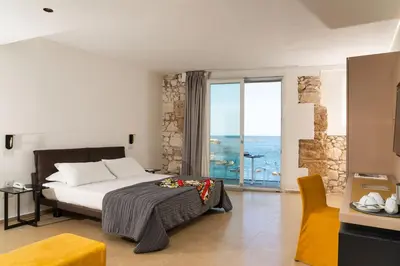 Letto o letti in una camera di Re Dionisio Luxury Suites