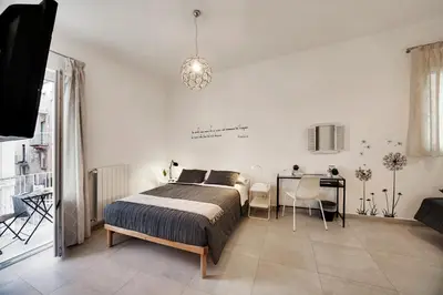 Letto o letti in una camera di Piazza Salvatore 7, gocce di sicilia