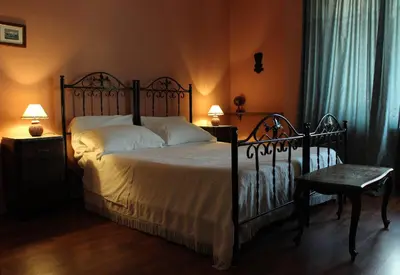 Letto o letti in una camera di B&B Al Mercato di Ortigia