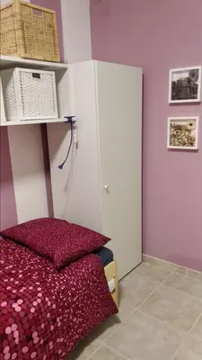 Letto o letti in una camera di B&B Rossini