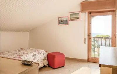 Letto o letti in una camera di Villa Marina
