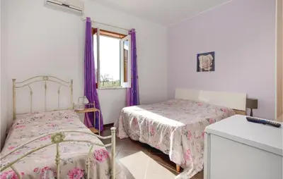 Letto o letti in una camera di Villa Emma