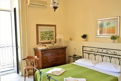 Letto o letti in una camera di Al Teatro Massimo Suites