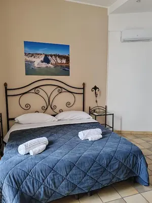 Letto o letti in una camera di Life Hotels Residence dei Baroni