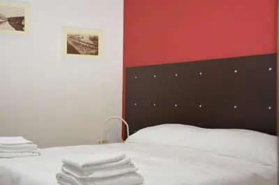 Letto o letti in una camera di Garibaldi Flat
