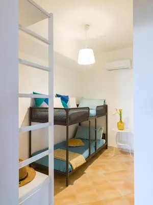 Letto o letti in una camera di Harbor Houses