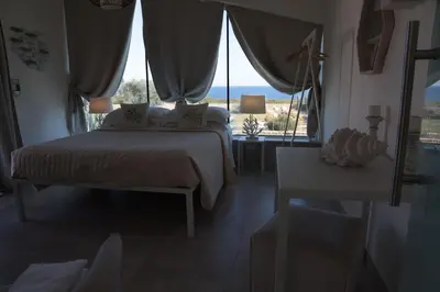 Letto o letti in una camera di CORALLI DEL PLEMMIRIO