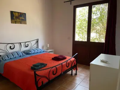 Letto o letti in una camera di Punta del Cane