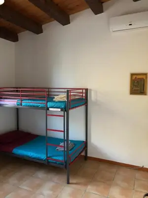 Letto o letti a castello in una camera di Punta del Cane