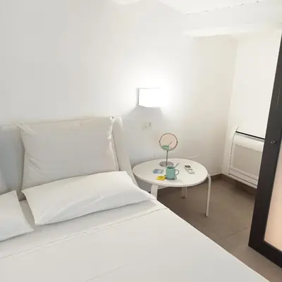 Letto o letti in una camera di Paolino Exclusive Rooms