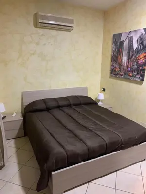 Letto o letti in una camera di Airport Bedroom House