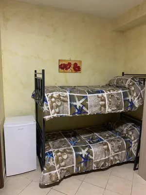 Letto o letti in una camera di Airport Bedroom House