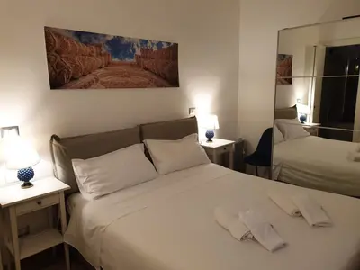 Letto o letti in una camera di Casa Sveva