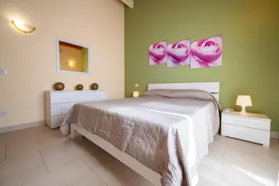 Letto o letti in una camera di Villa Tonnara Vista Mare - SiciliaVacanza