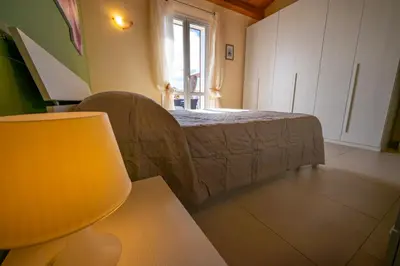 Letto o letti in una camera di Villa Tonnara Vista Mare - SiciliaVacanza