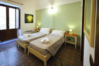 Letto o letti in una camera di Cataneasy Rooms