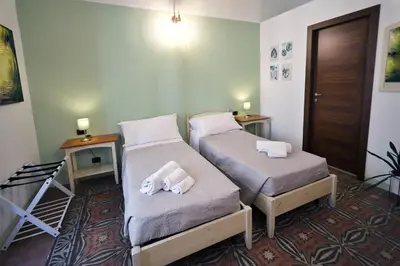 Letto o letti in una camera di Cataneasy Rooms
