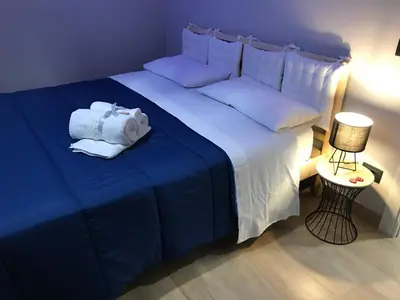 Letto o letti in una camera di Il Tempio di Athena - Cultura e Relax a Siracusa
