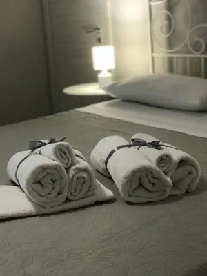 Letto o letti in una camera di Il Tempio di Athena - Cultura e Relax a Siracusa