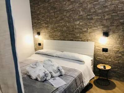Letto o letti in una camera di Il Tempio di Athena - Cultura e Relax a Siracusa