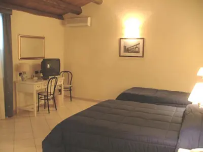 Letto o letti in una camera di Hotel Relais Modica
